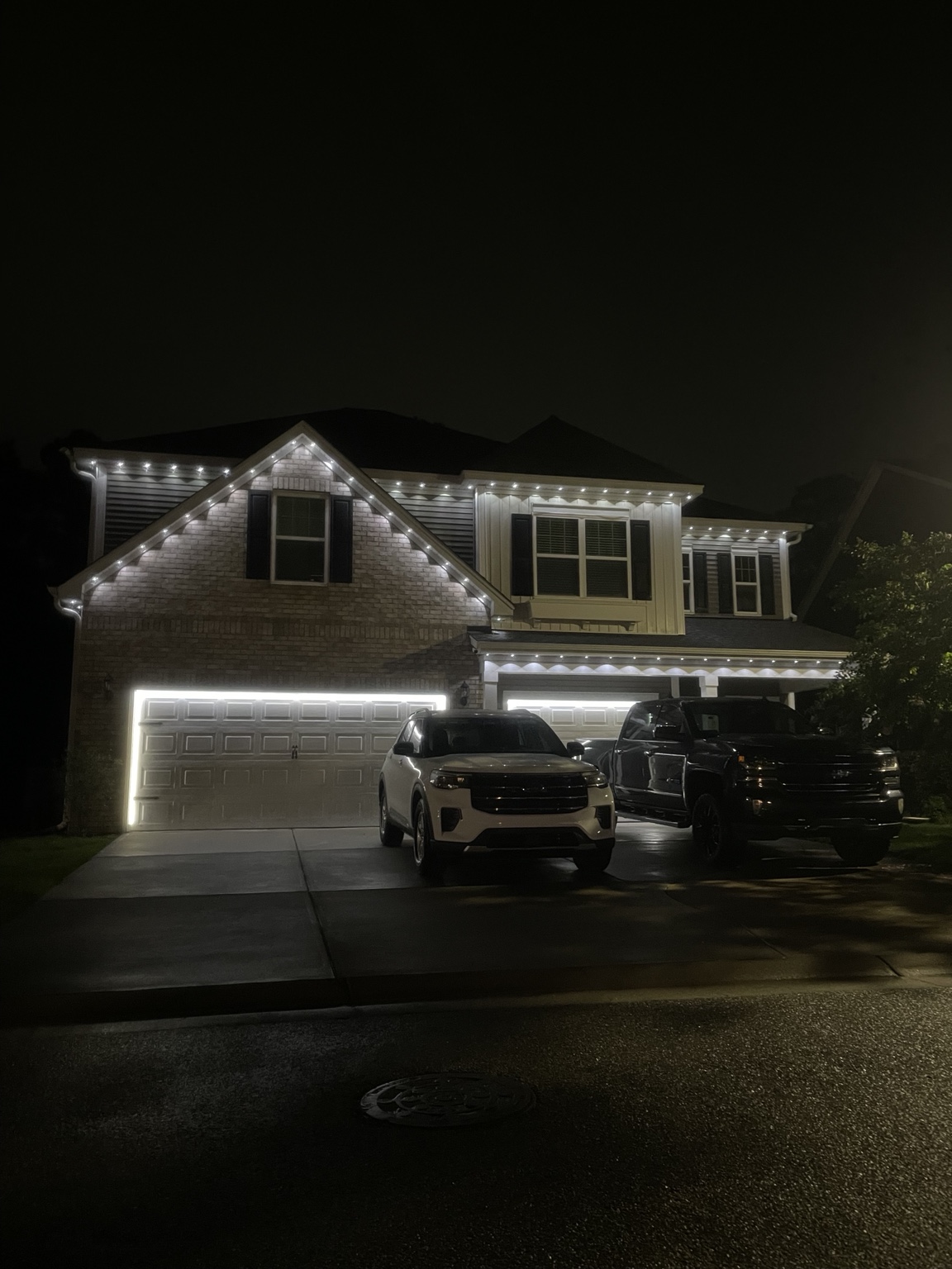 Home outlined in elegant white lights